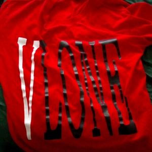 A red vlone shirt